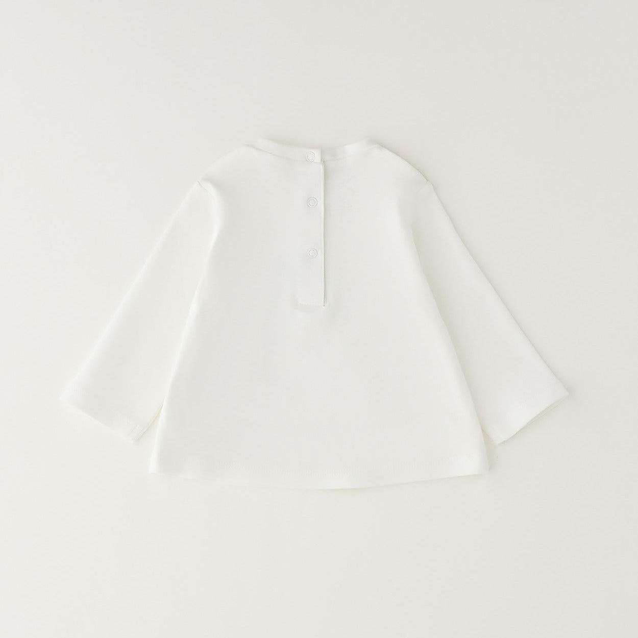 Giacca bimba in caldo cotone color panna con balza e chiusura frontale