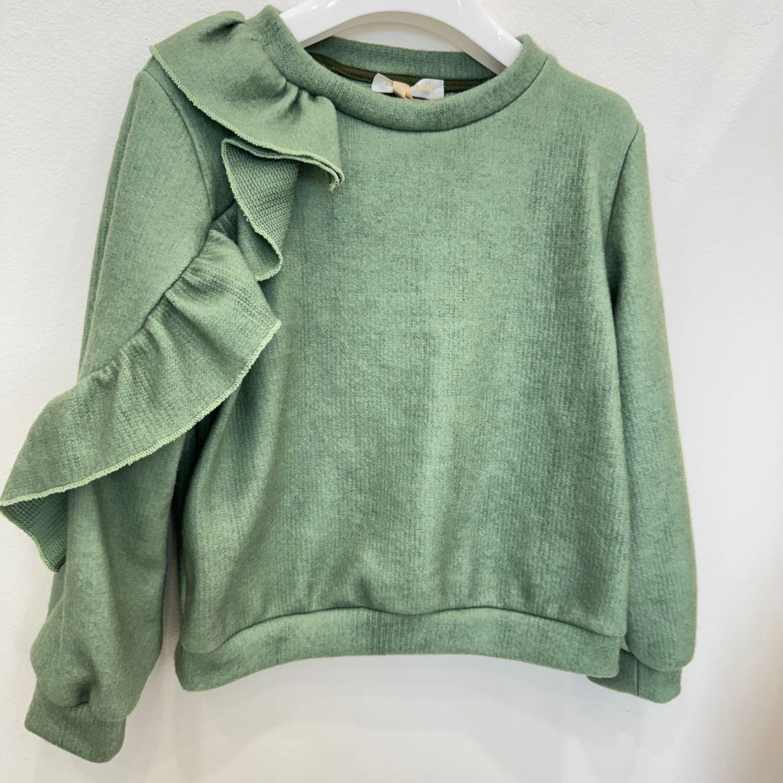 maglia bambina verde elegante con volant su spalla e manica