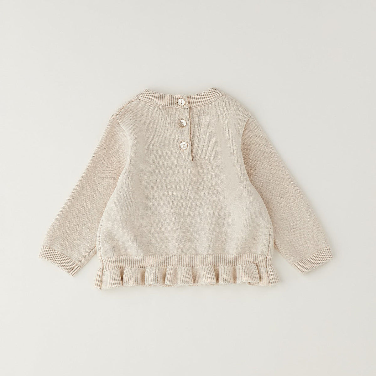 Maglioncino bimba beige in cotone e lana con fiori gialli applicati e volant