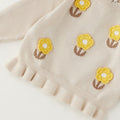 Maglioncino bimba beige in cotone e lana con fiori gialli applicati e volant