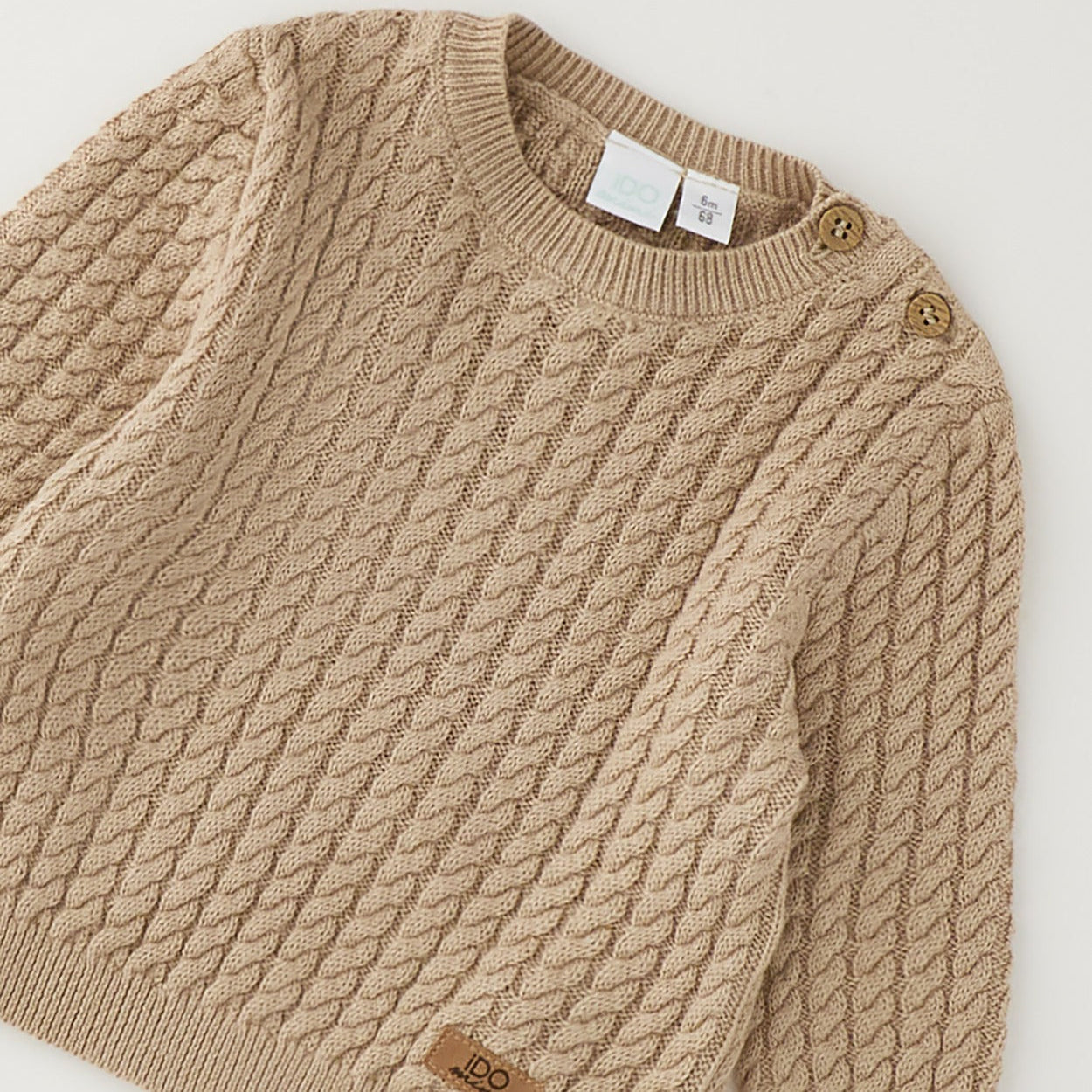Maglioncino neonato beige in cotone e lana con lavorazione a trecce