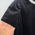 Abito elegante bambina nero con tre maxi fiocchi avorio e maniche a palloncino