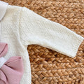  Manica in maglia lavorata panna della tutina neonata, ideale per stagione autunnale