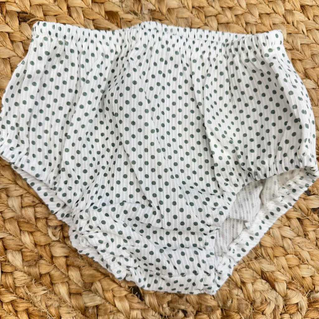  Mutandina in cotone bianco a pois verdi, elastico in vita e sulle cosce per una vestibilità comoda.