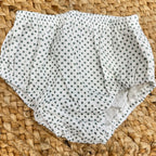  Mutandina in cotone bianco a pois verdi, elastico in vita e sulle cosce per una vestibilità comoda.