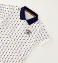 Completo bambino con polo fantasia in cotone e bermuda color sabbia stile casual chic.
