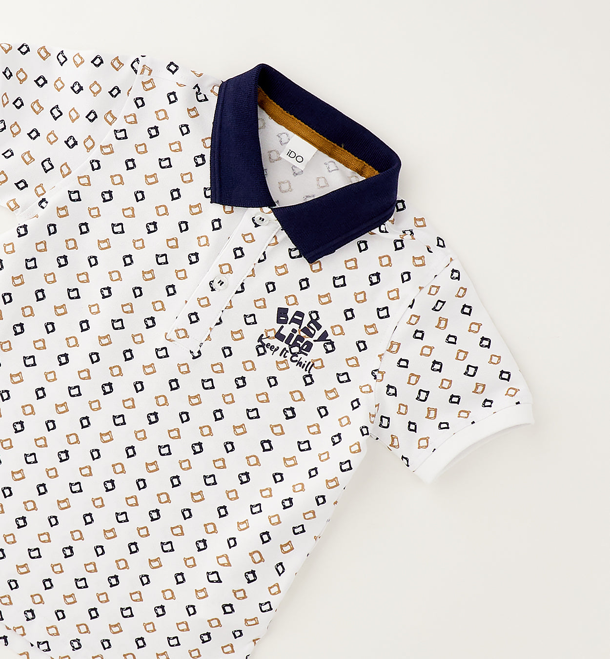 Completo bambino con polo fantasia in cotone e bermuda color sabbia stile casual chic.