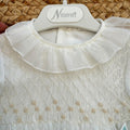 Pagliaccetto battesimo bimba avorio con punto smock, ricami beige e volant