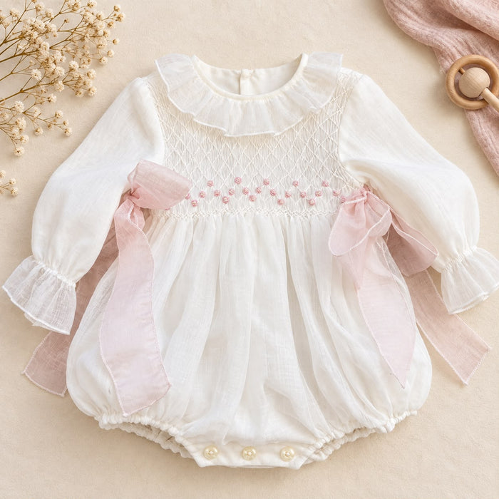 Pagliaccetto battesimo bimba con smock e fiocchi rosa, foto 1