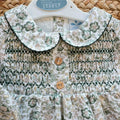Pagliaccetto bimba floreale verde Sardon in 100% cotone con punto smock