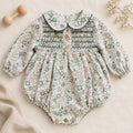 Pagliaccetto bimba floreale verde Sardon in 100% cotone con punto smock