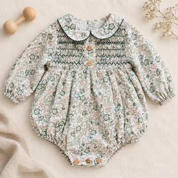 Pagliaccetto bimba floreale verde Sardon in 100% cotone con punto smock