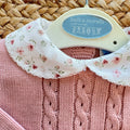 Pagliaccetto bimba rosa in maglia con parte floreale e colletto coordinato