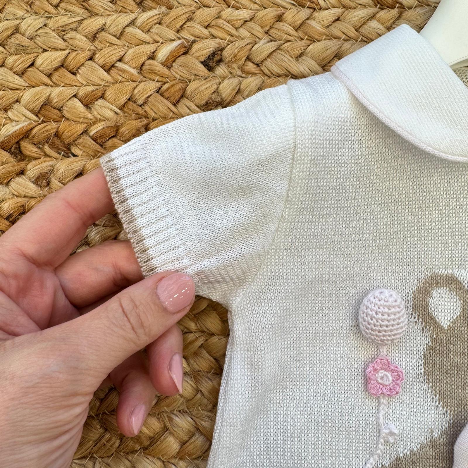 dettaglio manica pagliaccetto neonata in cotone