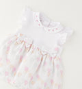 pagliaccetto neonata elegante con gonnellina cuori e fiocchetti decorativi