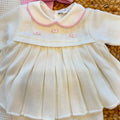 Uscita clinica neonata in pura lana con copertina latte e rosa confetto Made in Italy.