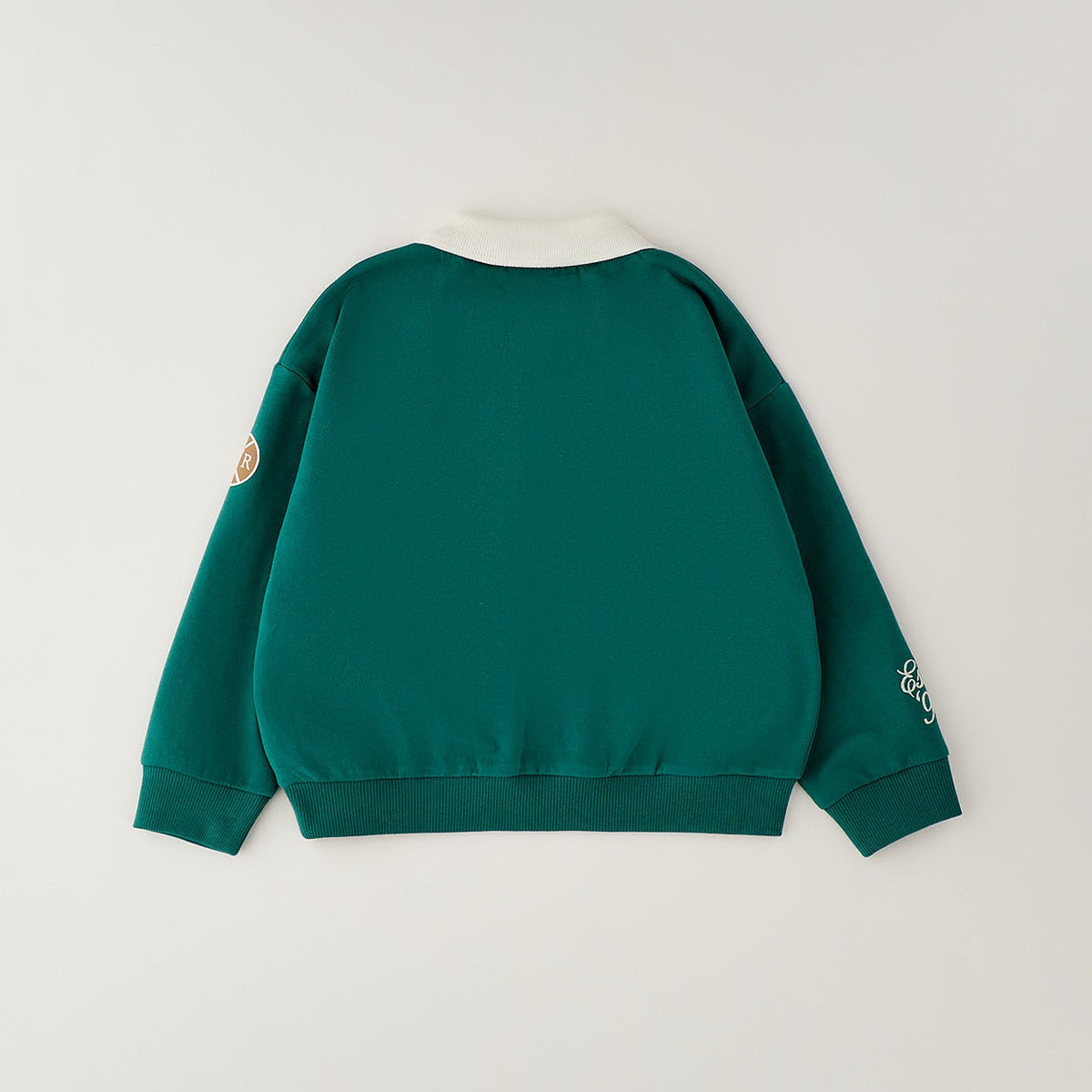 Completo bimbo con polo verde ricamata e pantalone panna