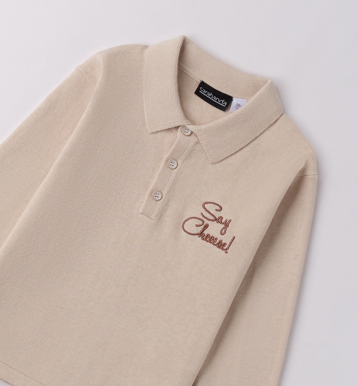 polo bambino beige dettaglio colletto e bottoni