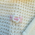 Uscita clinica neonata in pura lana con copertina latte e rosa confetto Made in Italy.