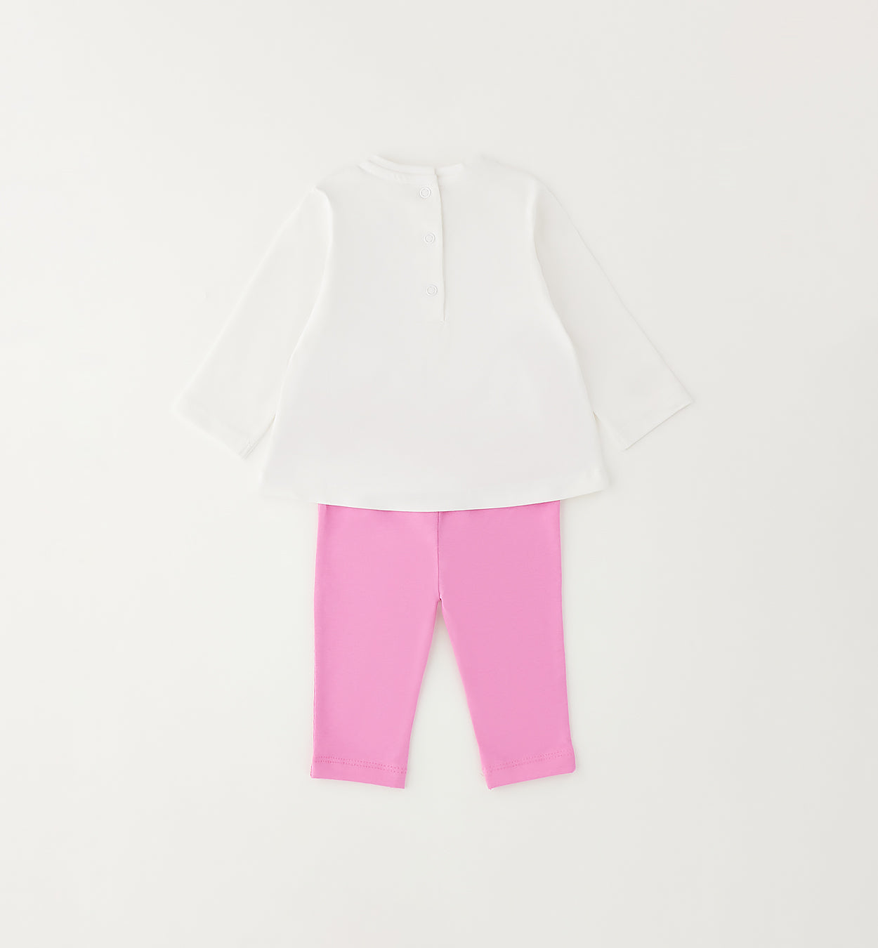 Retro completo bimba con maglia bianca e leggings rosa