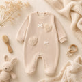 Retro tutina neonata beige in ciniglia con piedini e apertura con bottoncini