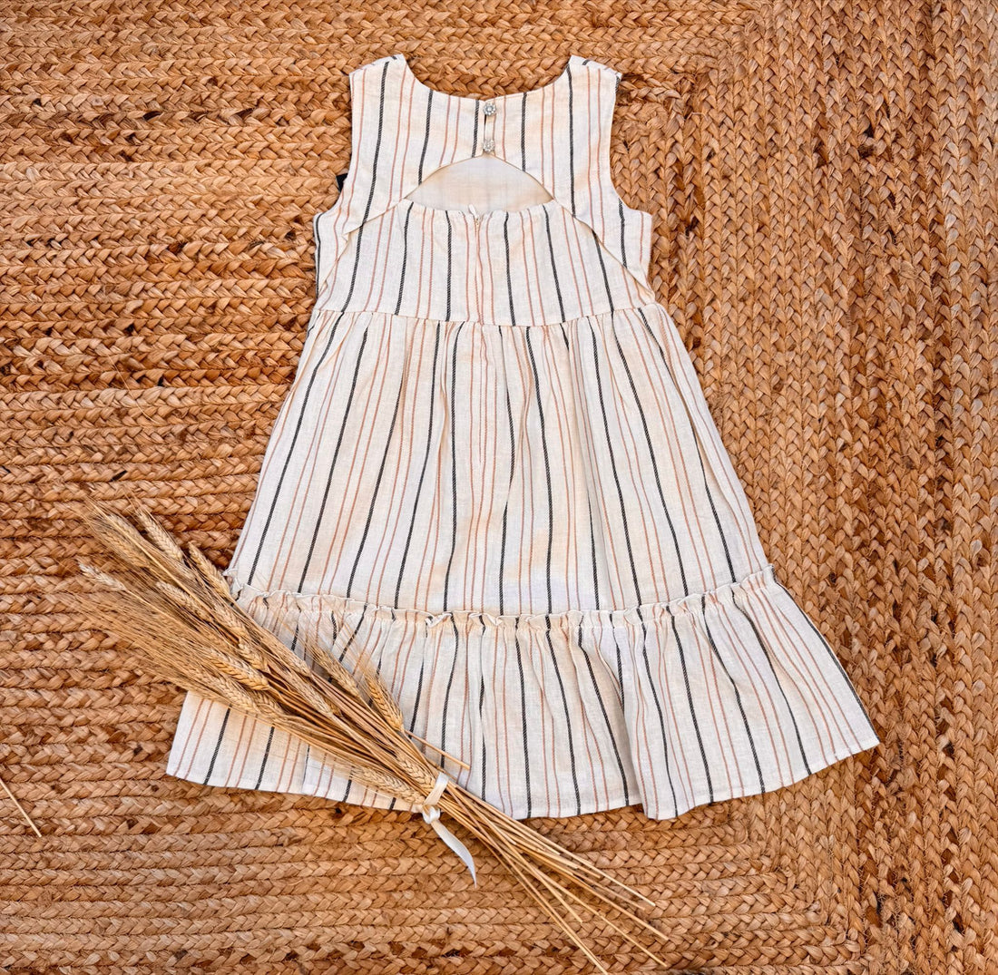 Vestito estivo bambina in lino a righe beige e nere con fiocco.