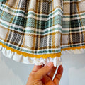Vestito elegante bimba verde salvia con fantasia scozzese, ideale per cerimonie e occasioni speciali.