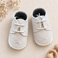 Scarpe battesimo bimbo beige con lacci e dettagli traforati