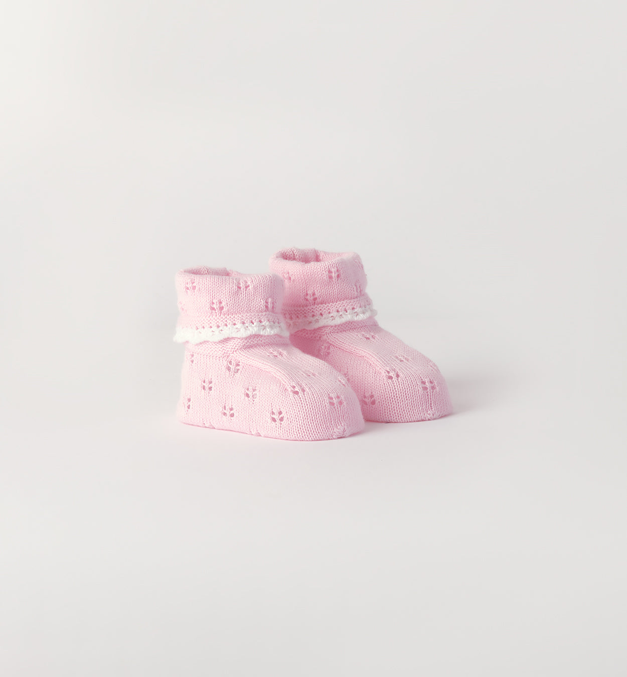 Scarpette neonata rosa 100% cotone con lavorazione traforata
