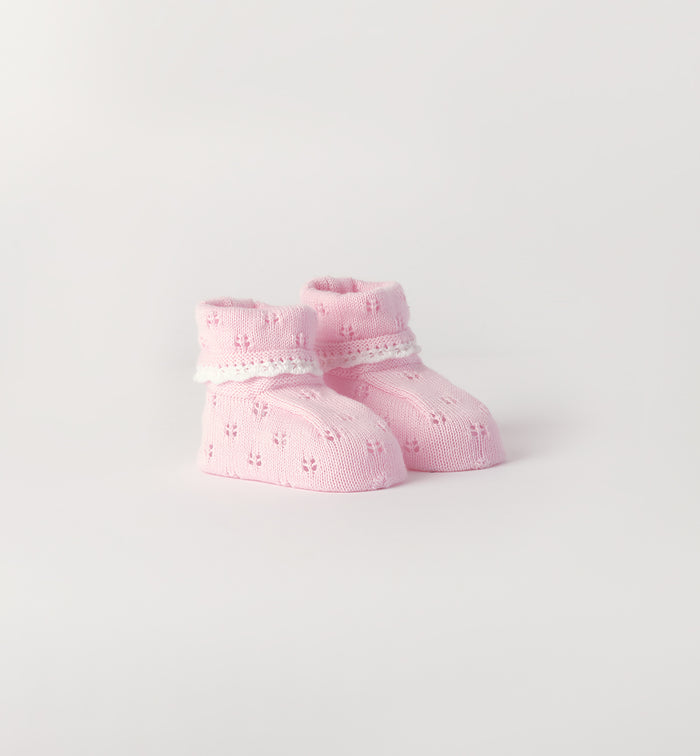 Scarpette neonata rosa 100% cotone con lavorazione traforata
