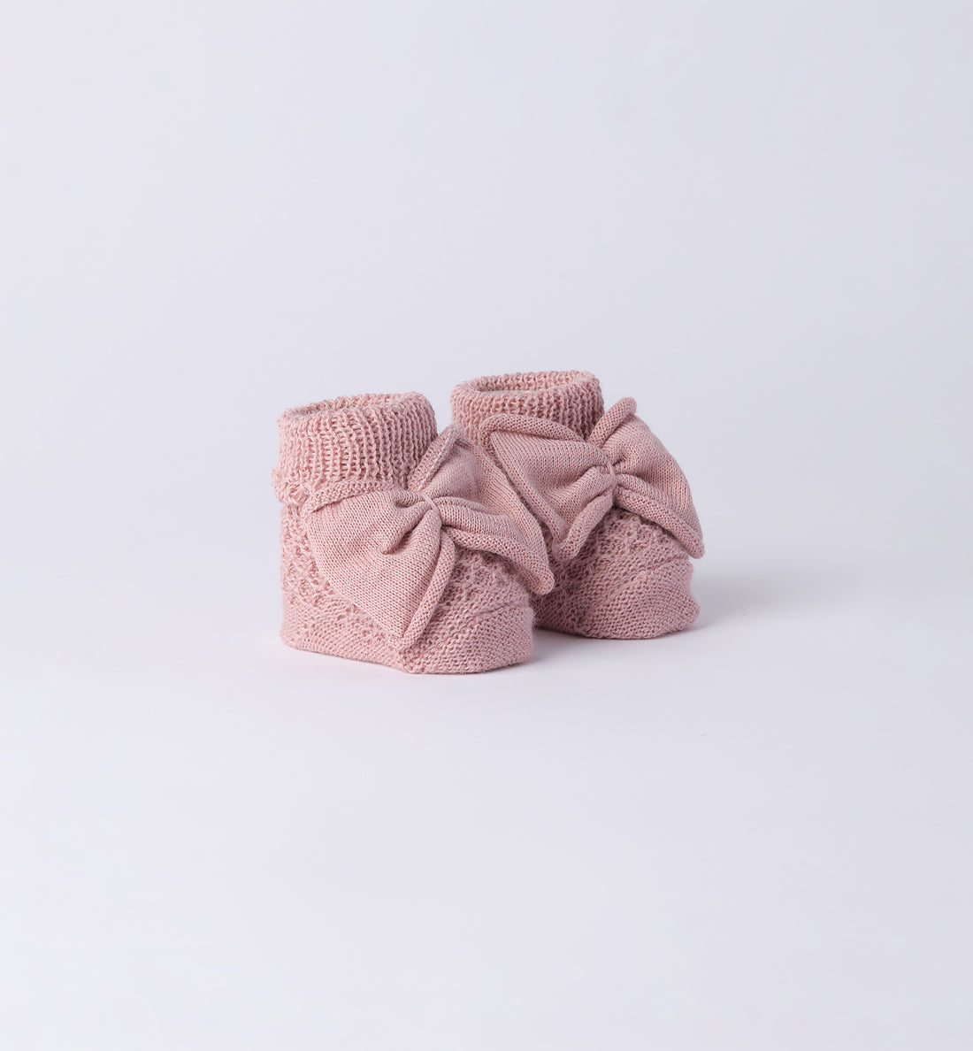 scarpette neonata in caldo cotone rosa con fiocco centrale lavorato a maglia