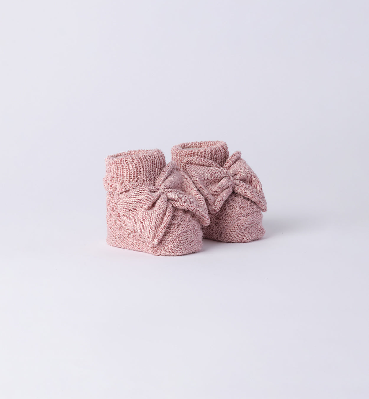 scarpette neonata in caldo cotone rosa con fiocco centrale lavorato a maglia