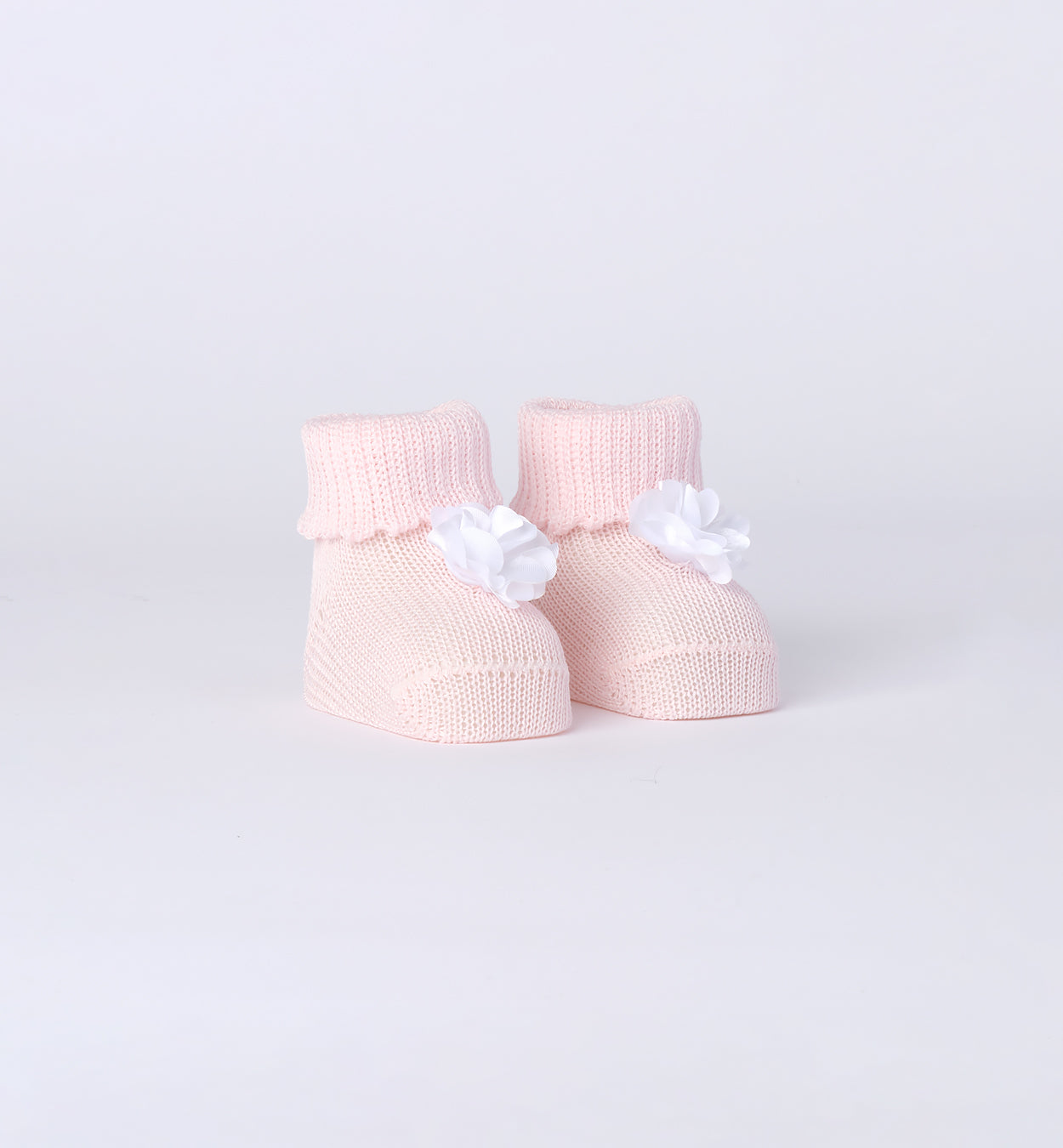  Scarpine culla in maglia rosa pastello con fiore in raso