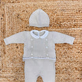 Coprifasce neonato beige in maglia con colletto bianco