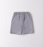Completo bambino con t-shirt bianca "Enjoy the Ride" e shorts a righe blu.