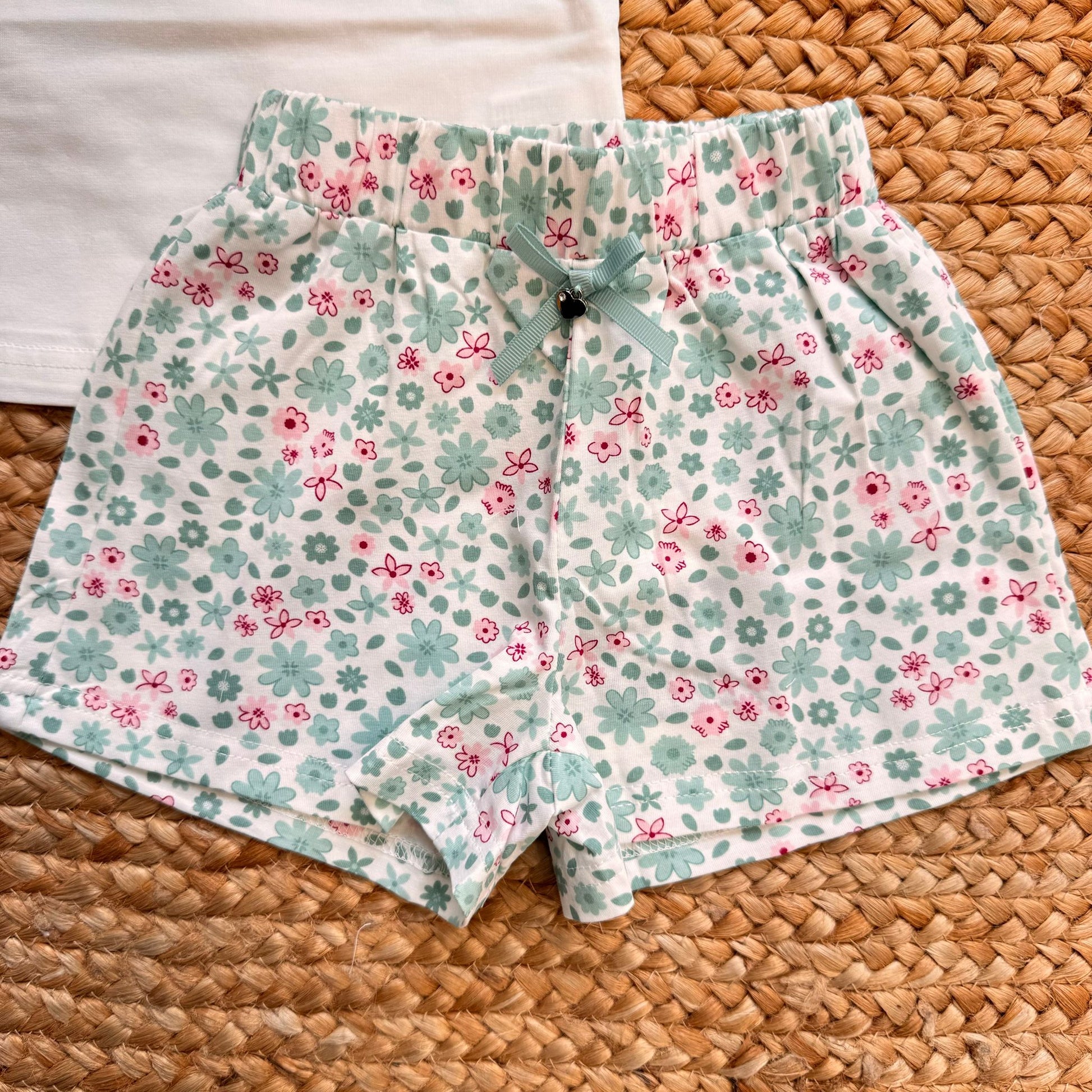 shorts bimba cotone fantasia floreale verde acqua con fiocco