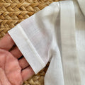 dettaglio tessuto camicia body battesimo neonato