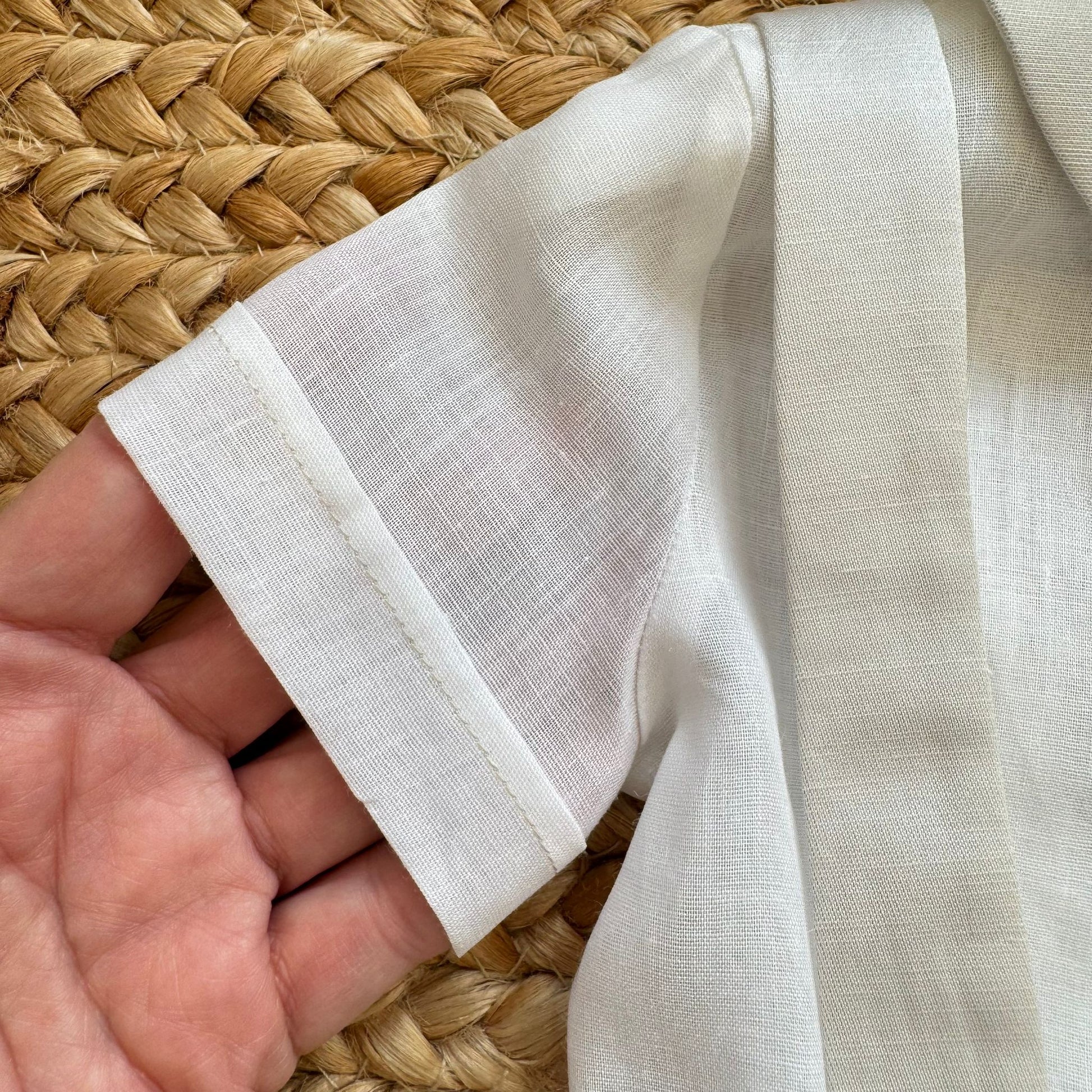 dettaglio tessuto camicia body battesimo neonato