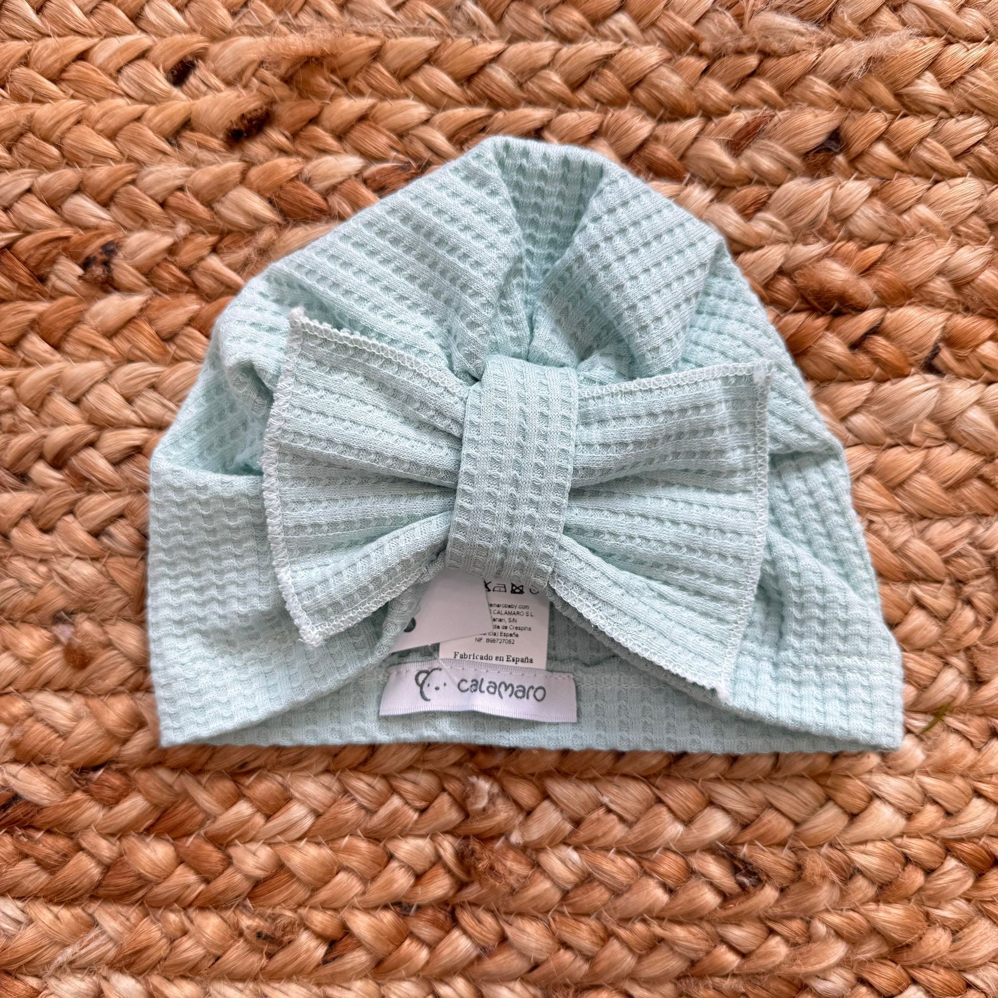 Turbante verde acqua per neonata con maxi fiocco in tessuto nido d’ape