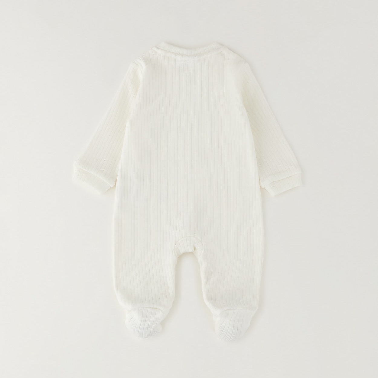 Tutina unisex neonato in caldo cotone bianco latte con bottoncini e piedini chiusi