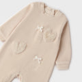 Retro tutina neonata beige in ciniglia con piedini e apertura con bottoncini