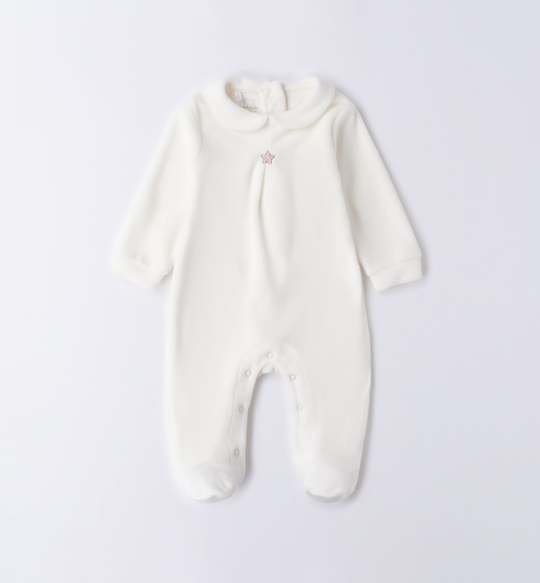 Tutina unisex in ciniglia panna con stellina beige vista frontale.