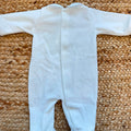 Tutina neonato in ciniglia color cielo con colletto bianco ricamato e fiocchetti.