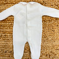 Tutina neonata in ciniglia panna con ricami floreali e fiocco rosa Made in Italy.