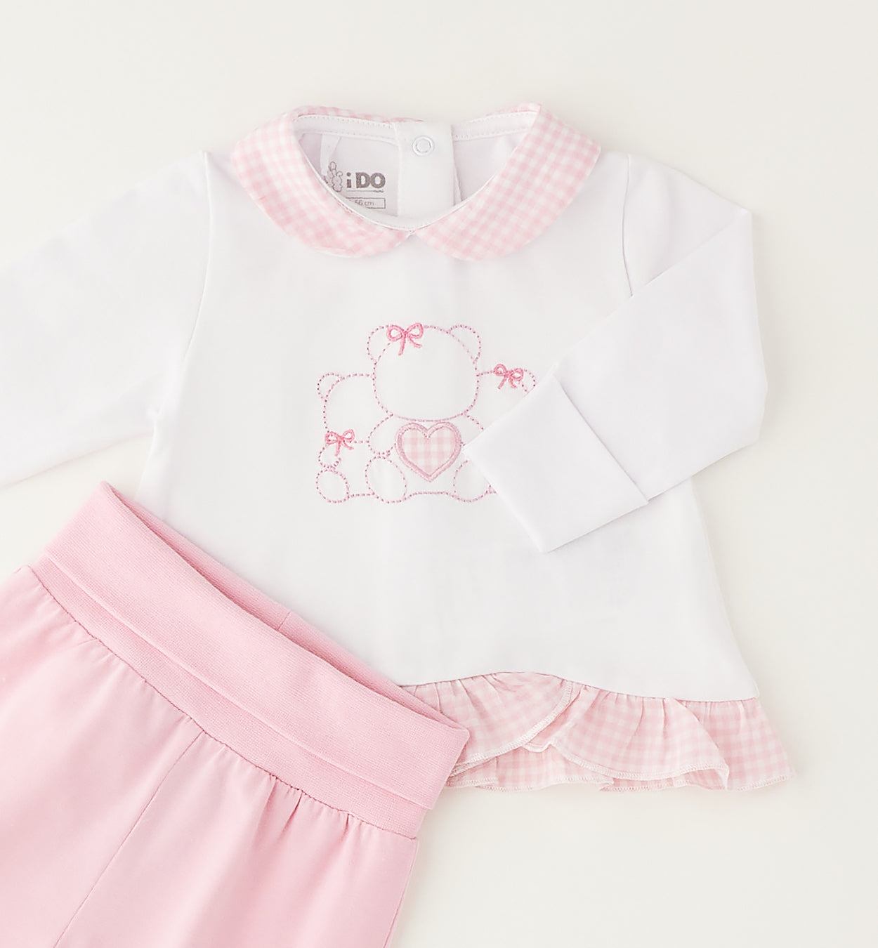 Retro tutina neonata in cotone con chiusura posteriore e piedini rosa coordinati