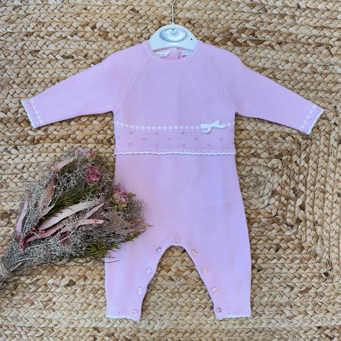 Tutina neonata rosa in cotone con colletto ruches e fiore applicato fronte