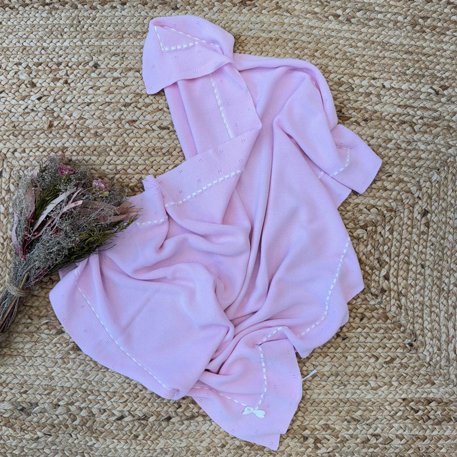 Copertina neonata in 100% cotone rosa con bordo ricamato