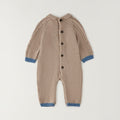 Tutina neonato tricot beige in 80% cotone e 20% lana con trecce, taschine e dettagli petrolio
