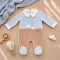 Tutina neonato in ciniglia azzurro cielo e beige con ricamo mongolfiera Made in Italy.