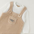 Tutina neonato in ciniglia beige e panna effetto salopette con piedini